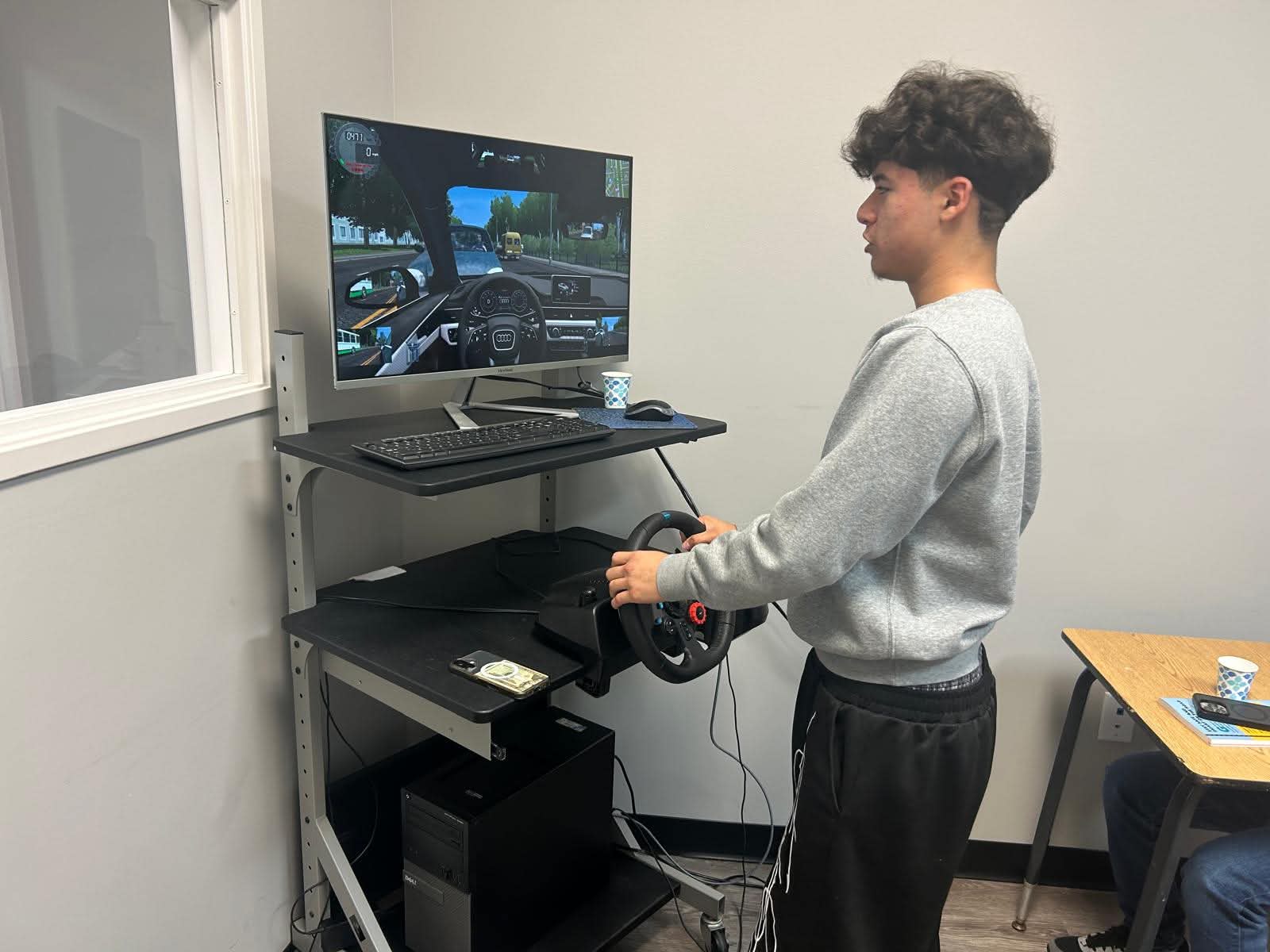 Student practicing on a driving simulator